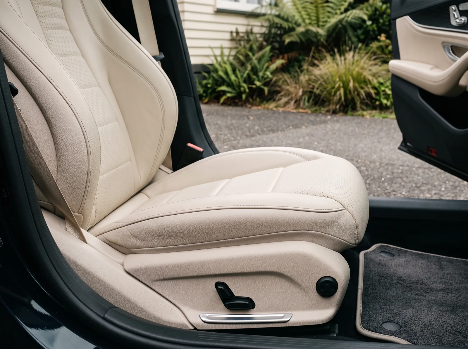 Illustrative close-up of a clean cream leather passenger seat